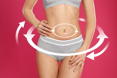 Image of Metabolism concept. Young woman with perfect body on pink background, closeup