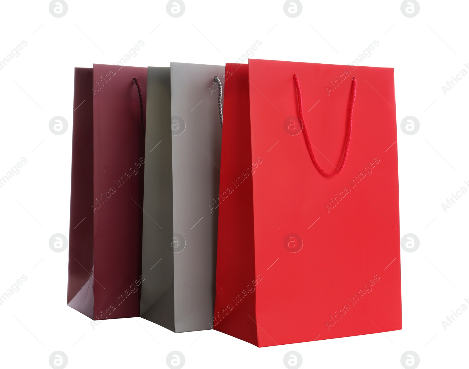 Photo of Different paper shopping bags isolated on white