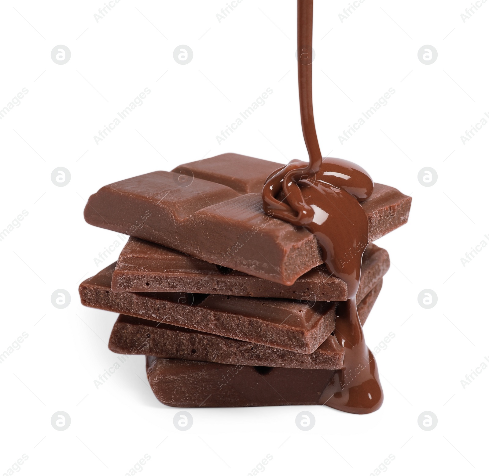 Photo of Pouring tasty milk chocolate paste onto pieces isolated on white