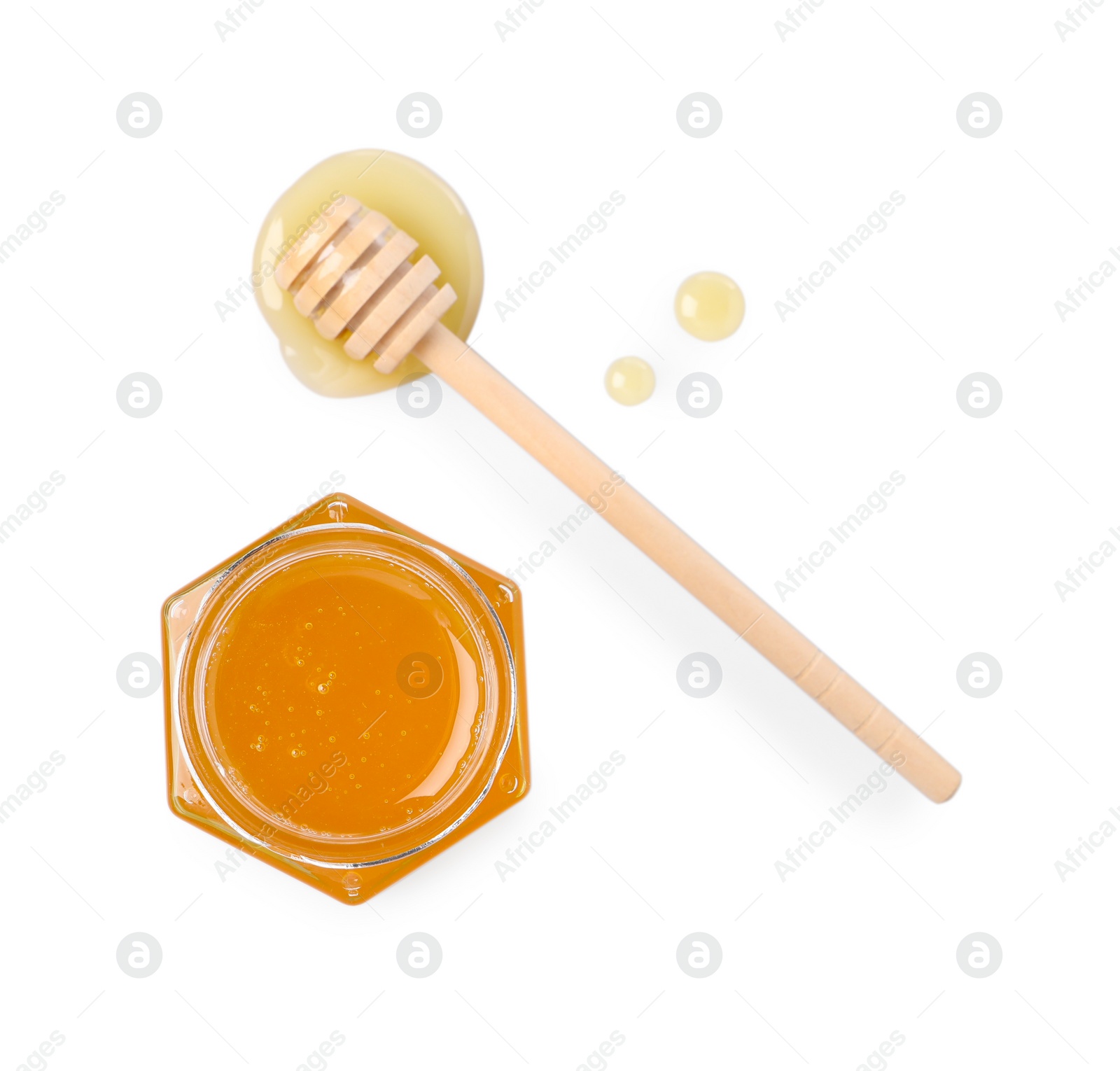 Photo of Tasty honey in glass jar and dipper isolated on white, top view