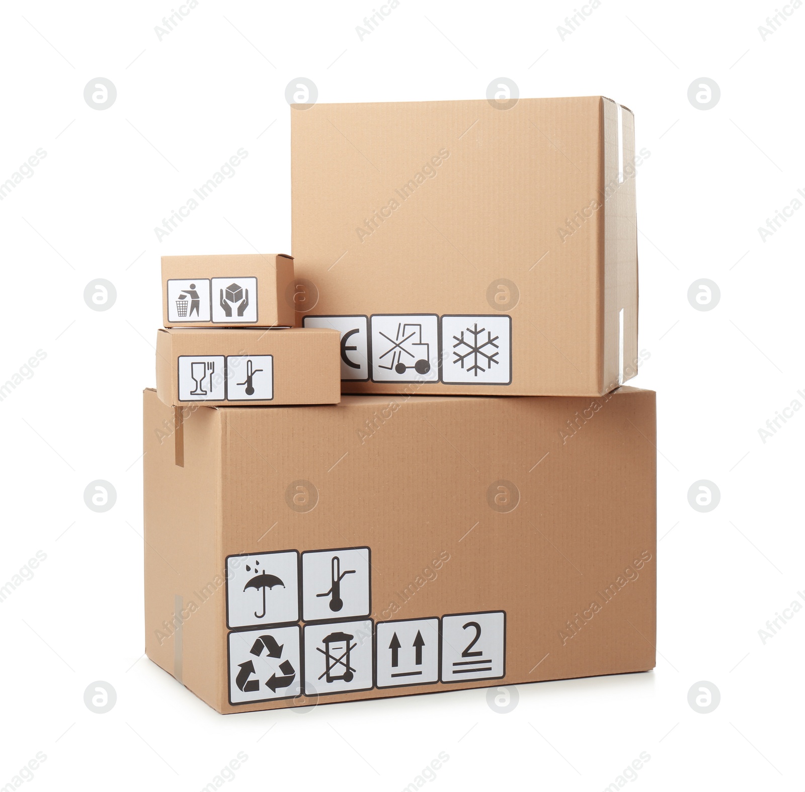 Photo of Cardboard boxes with different packaging symbols on white background. Parcel delivery