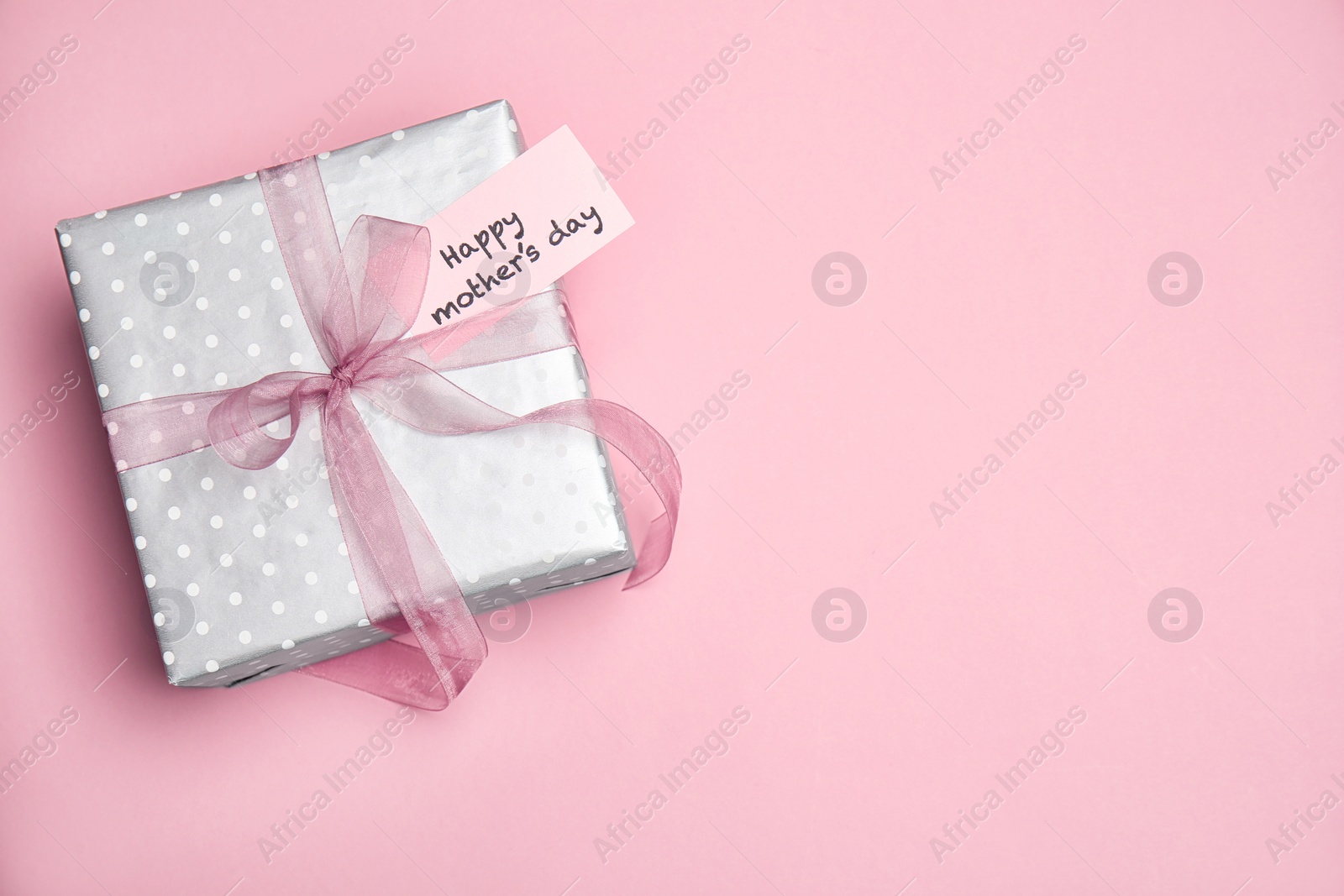 Photo of Elegant gift box for Mother's Day on color background, top view