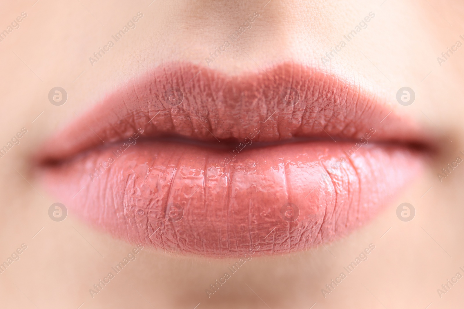 Photo of Woman with beautiful makeup created by professional artist. Focus on lips