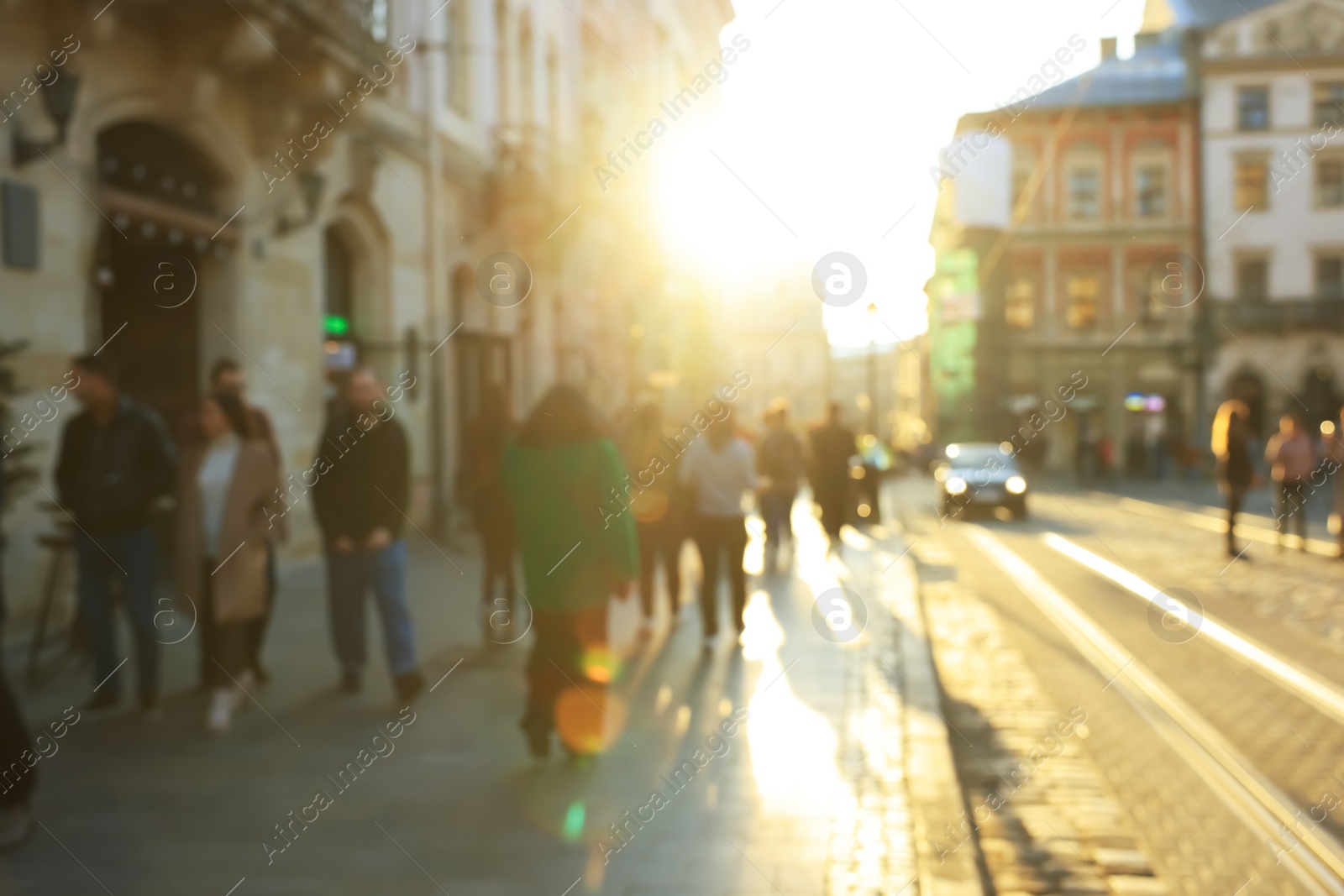 Photo of Blurred view of people walking on city street