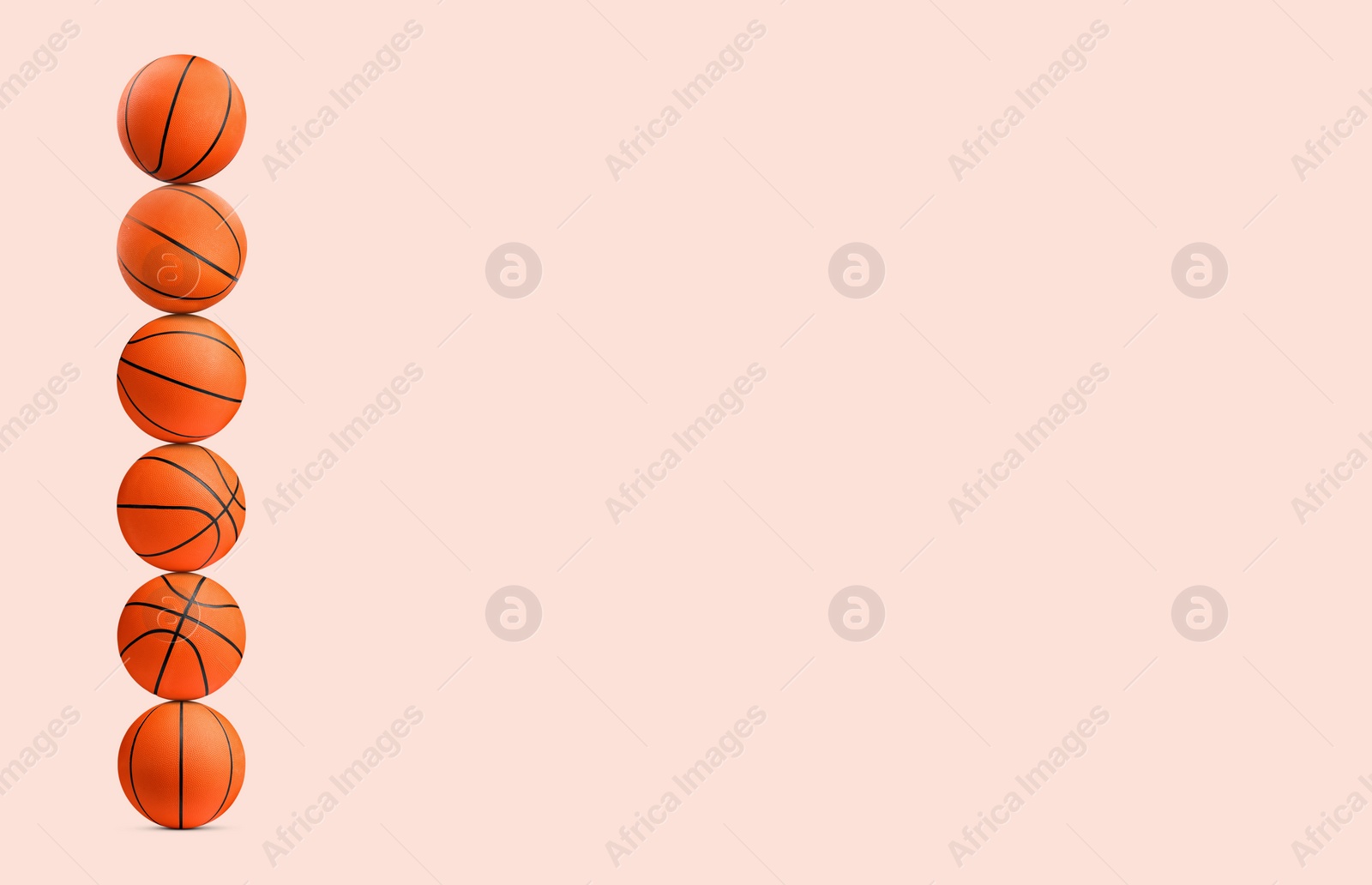 Image of Stack of basketball balls on beige background. Space for text