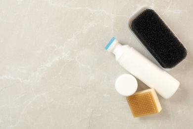 Photo of Flat lay composition with shoe care accessories on light grey background, space for text