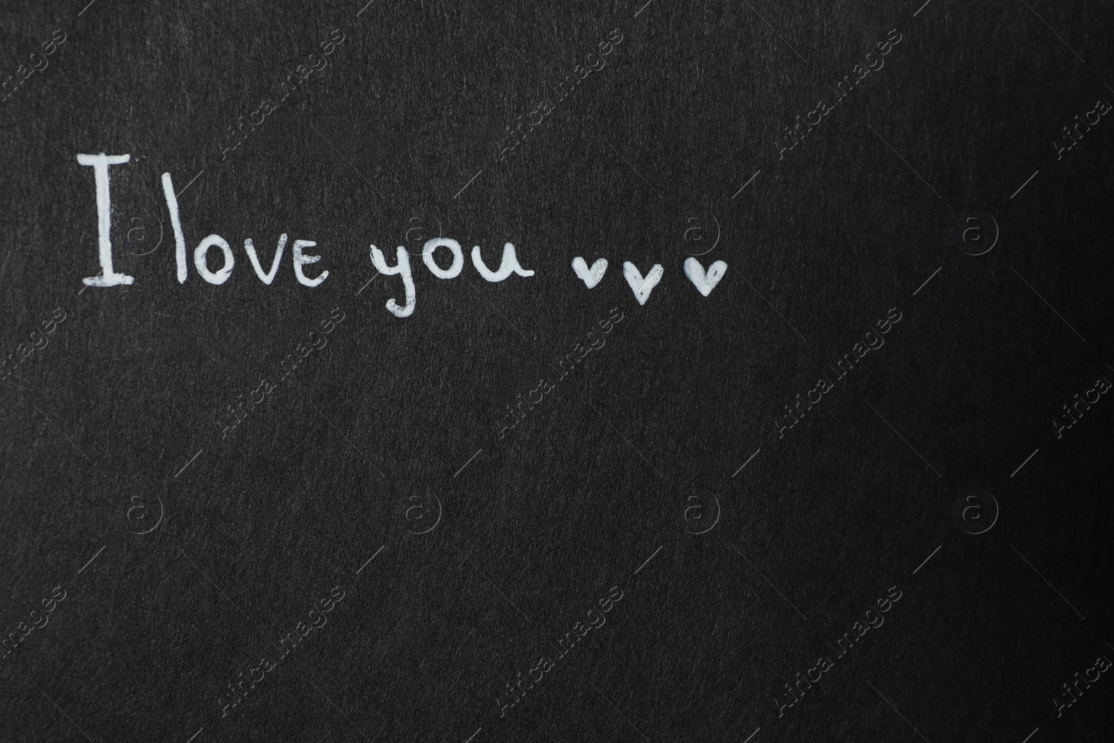Photo of Phrase I Love You on black background. Space for text