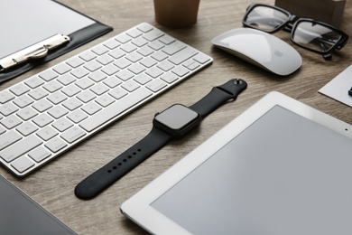 MYKOLAIV, UKRAINE - JULY 20, 2020: Composition with different Apple gadgets on wooden table