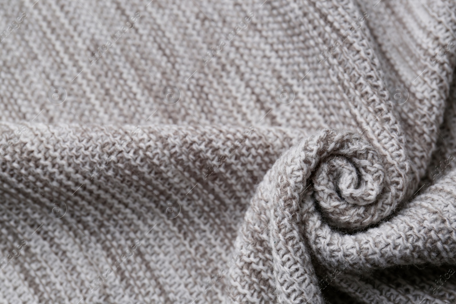 Photo of Beautiful grey knitted fabric as background, top view