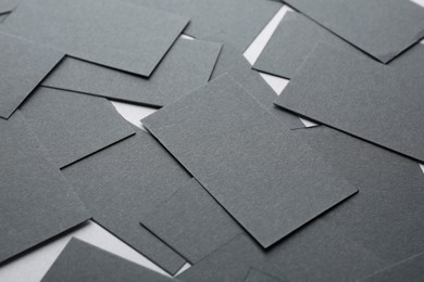Photo of Blank black business cards on table, closeup. Mockup for design