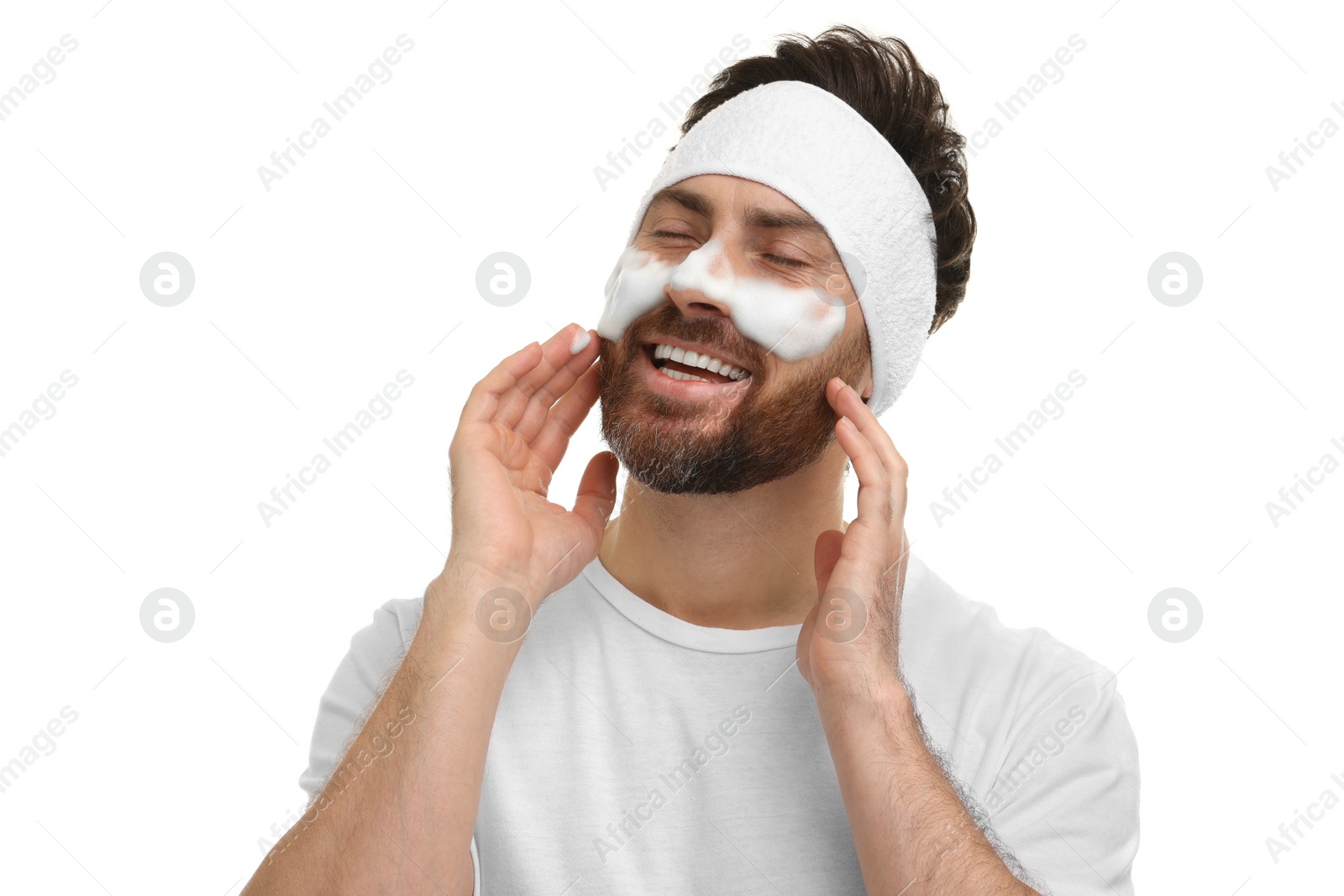 Photo of Man with headband washing his face on white background