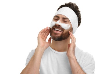 Photo of Man with headband washing his face on white background