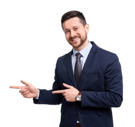 Handsome bearded businessman in suit pointing at something on white background