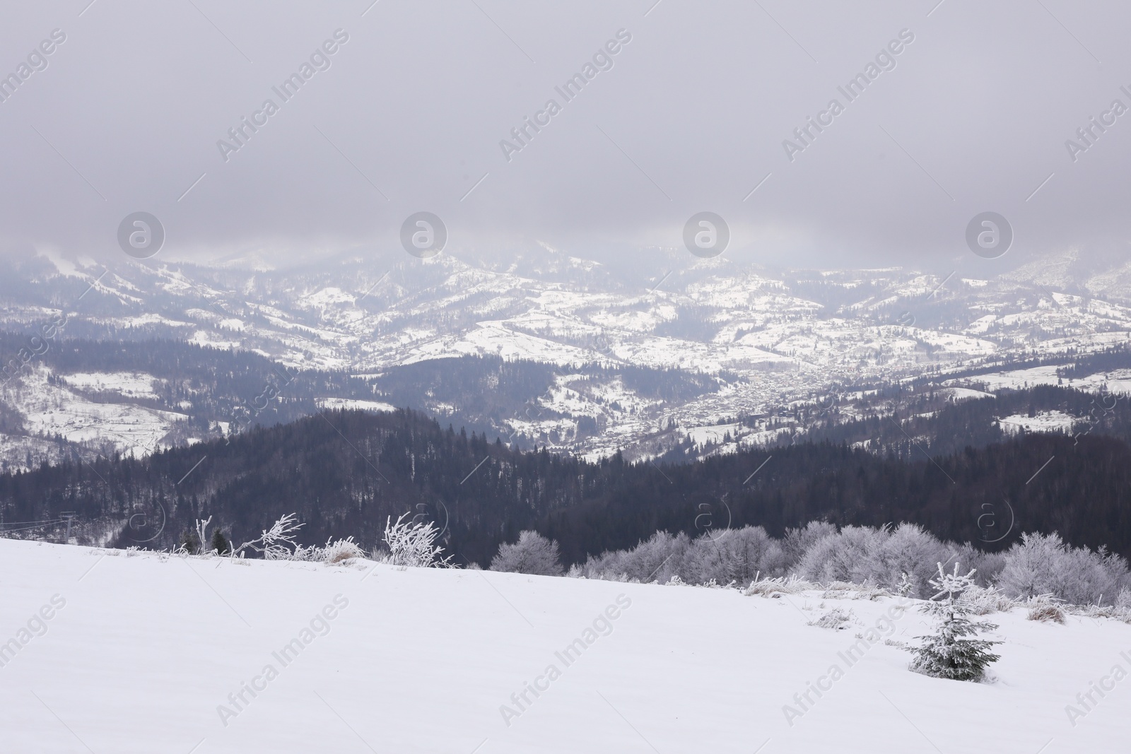 Photo of Picturesque mountain landscape with snowy hills on winter day