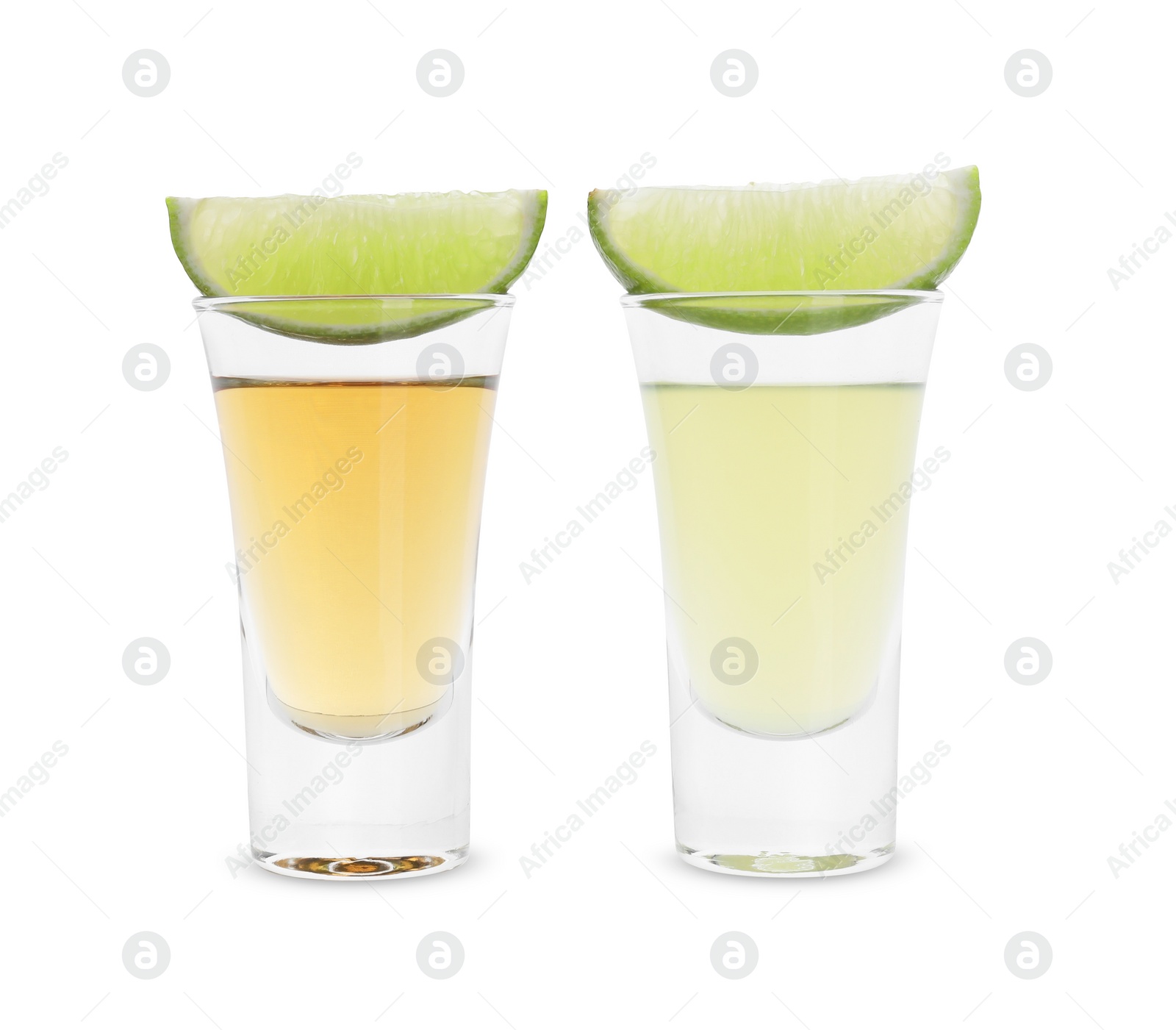 Photo of Different shooters in shot glasses and lime wedges isolated on white. Alcohol drink