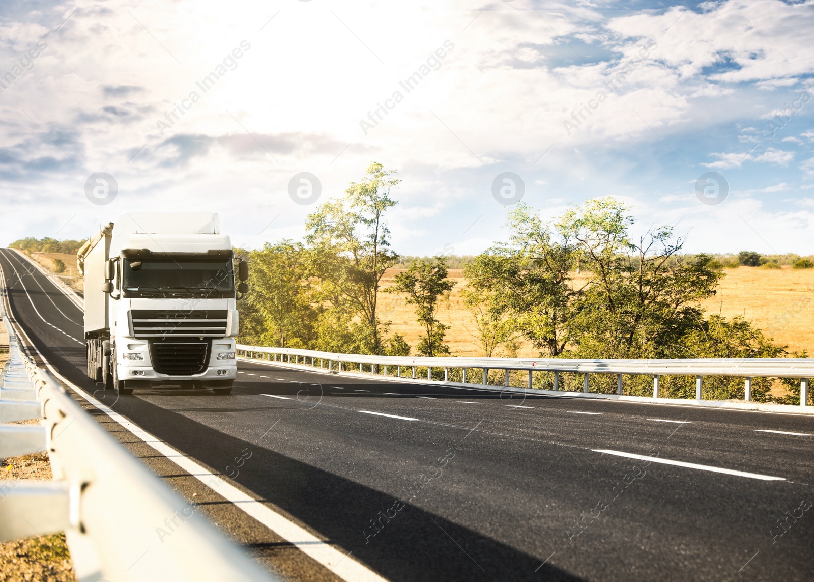 Photo of Beautiful view of asphalt highway with truck. Road trip