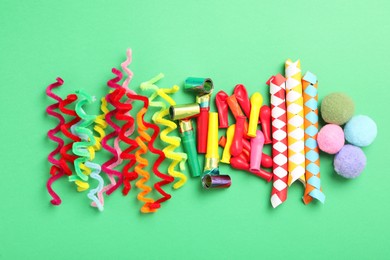 Different clown's accessories on green background, flat lay