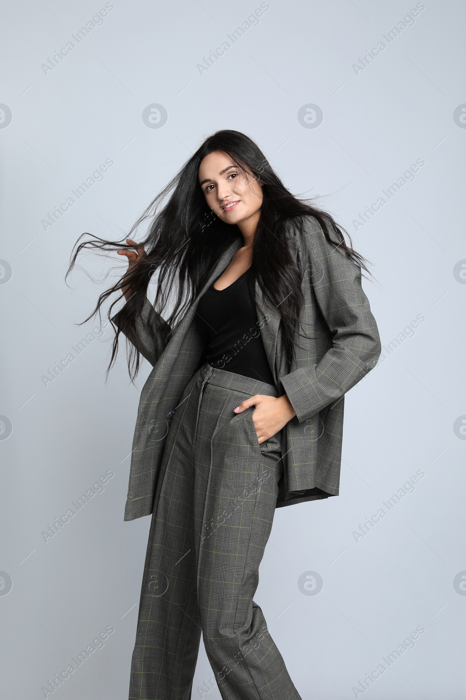 Photo of Beautiful woman in formal suit on white background. Business attire