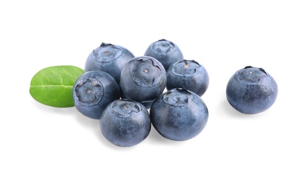 Photo of Fresh raw tasty blueberries with leaf isolated on white