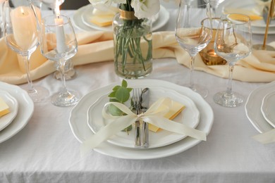 Photo of Festive table setting with beautiful floral decor