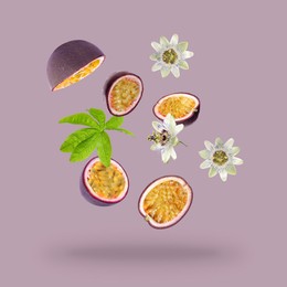 Image of Tasty passion fruits, passiflora leaf and flowers falling on pink background