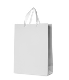 Photo of Paper shopping bag isolated on white. Mock up for design