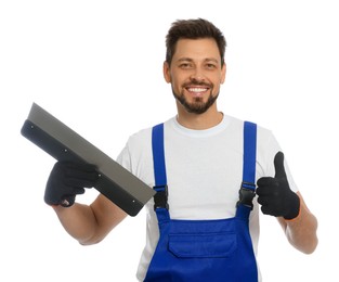 Photo of Professional worker in uniform with putty knife on white background