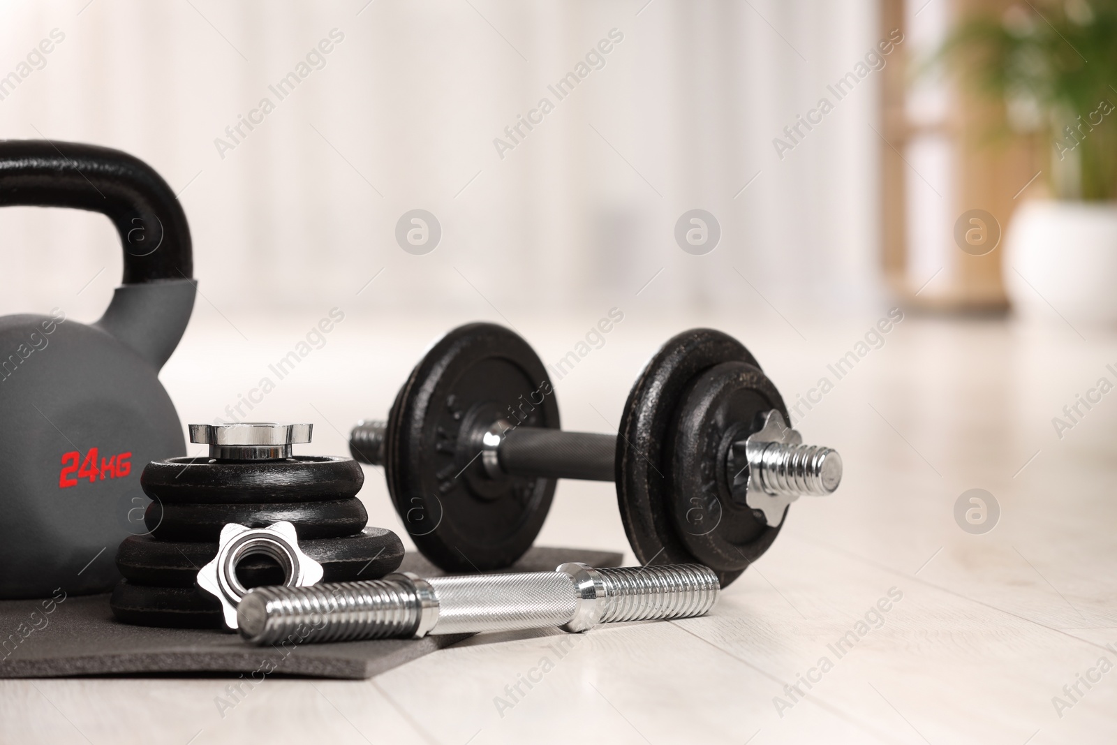 Photo of Many different sports equipment on floor indoors