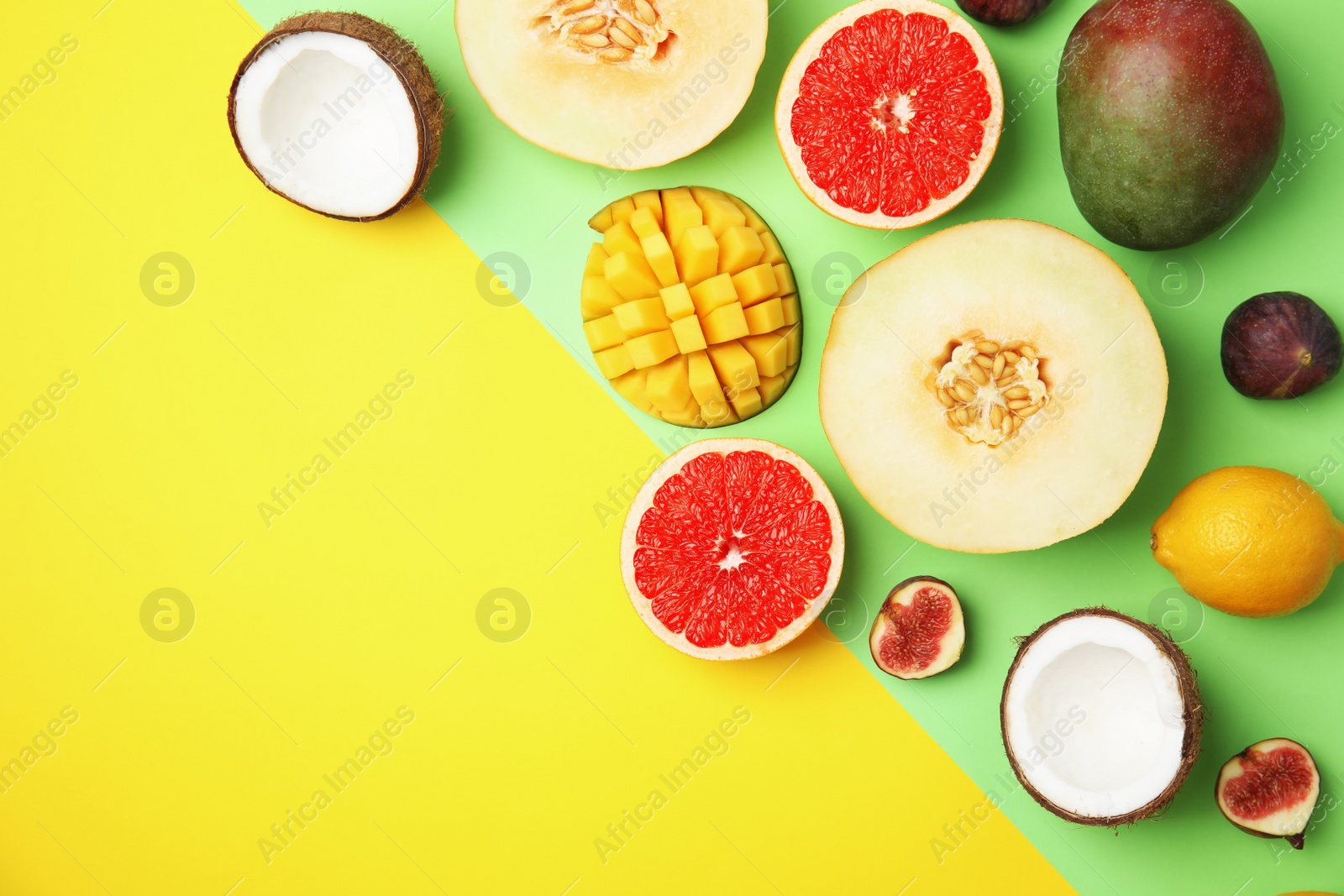 Photo of Flat lay composition with melon, other fruits and space for text on color background