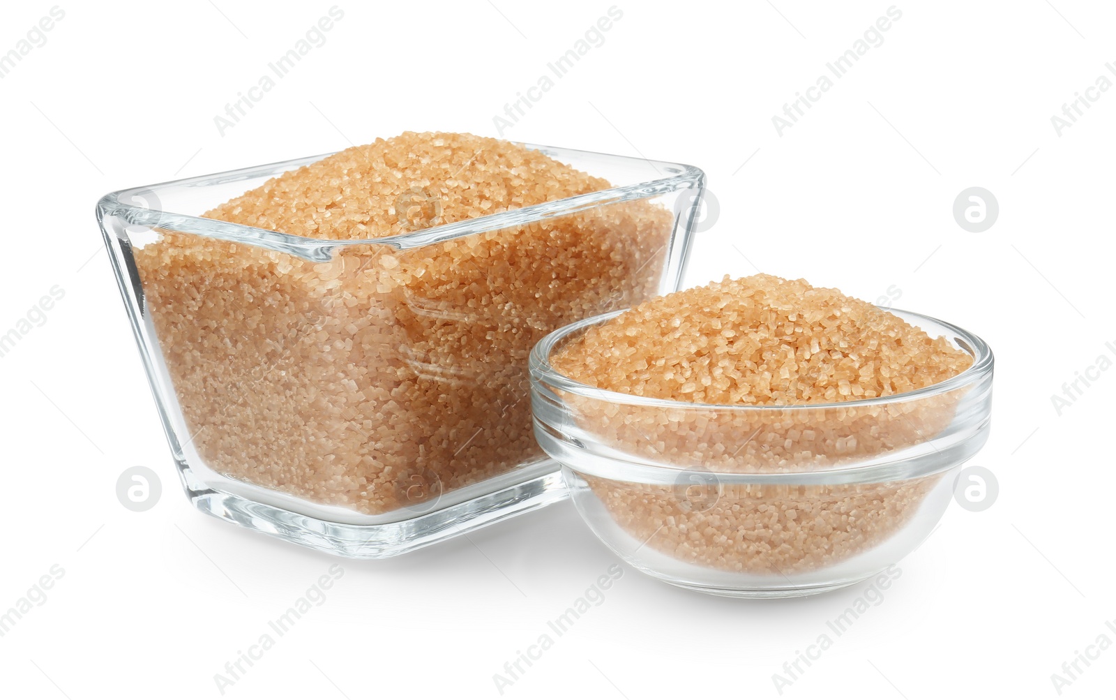 Photo of Brown sugar in glass bowls isolated on white