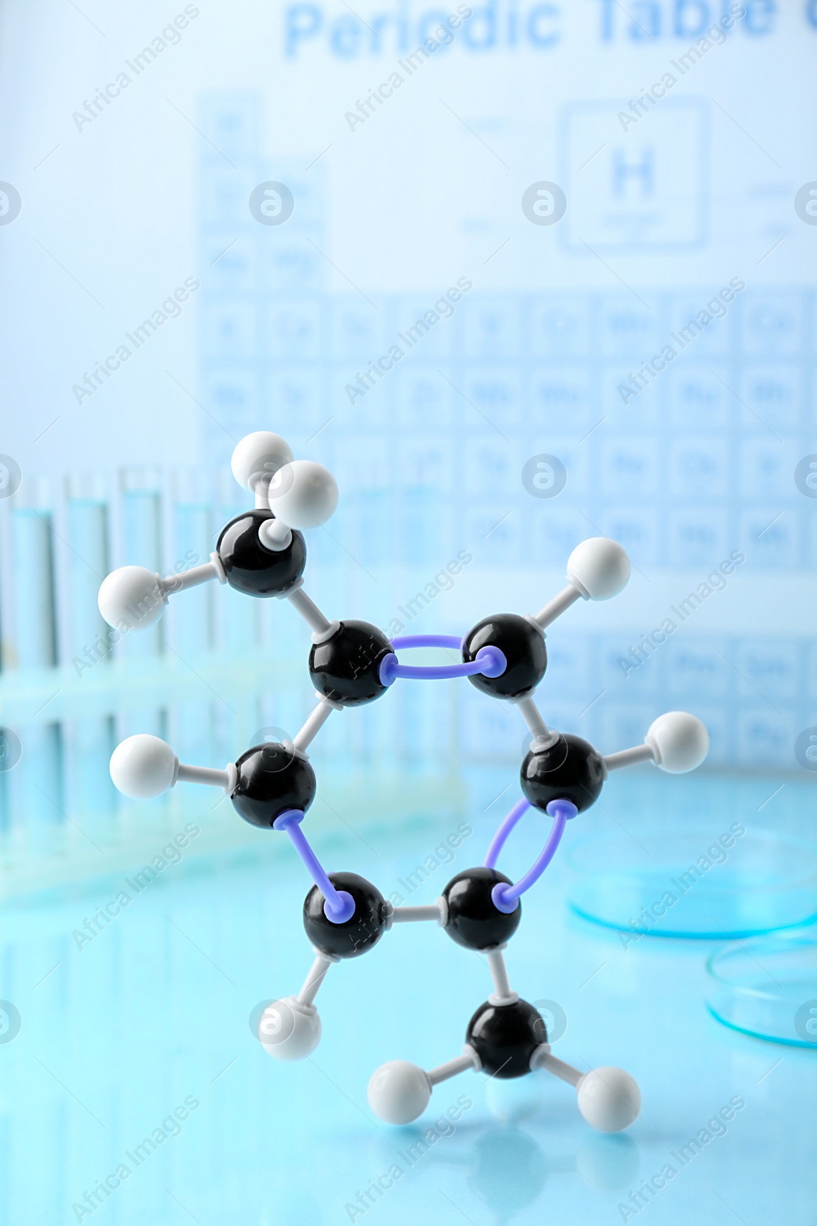 Photo of Molecular model on light surface against blurred background