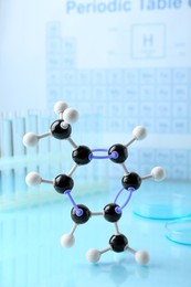 Photo of Molecular model on light surface against blurred background