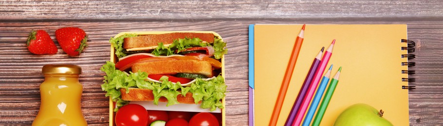 Image of School meal. Lunch box with healthy food and different stationery on wooden table, flat lay. Banner design