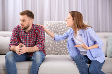 Photo of Couple having quarrel at home. Relationship problems