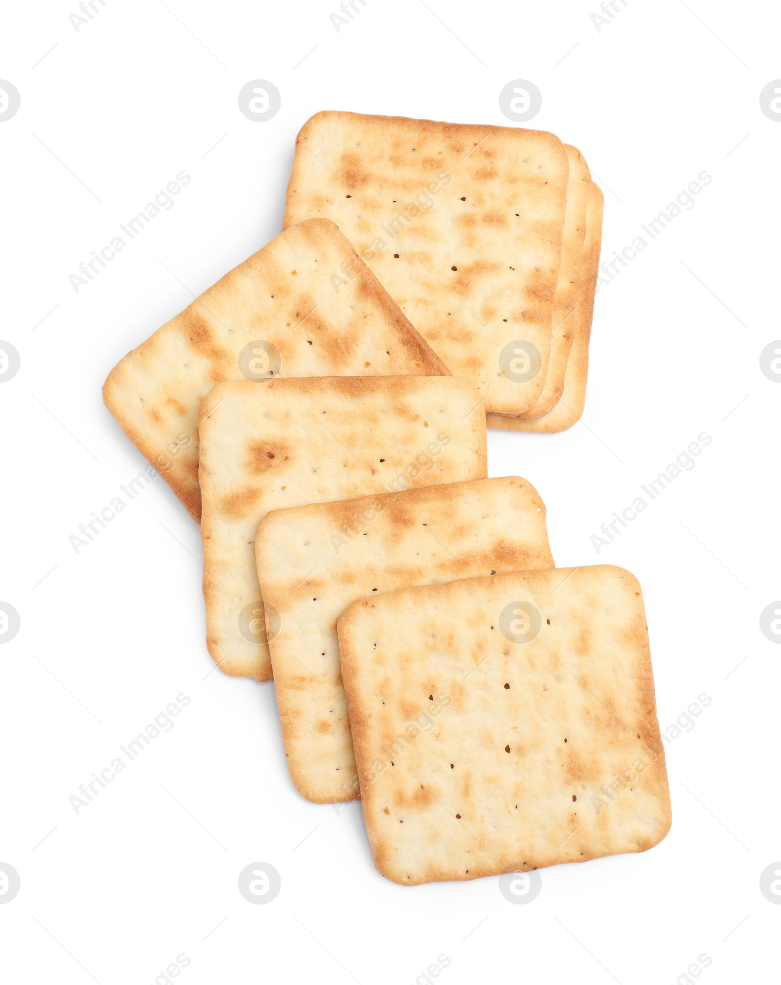 Photo of Tasty crispy square crackers isolated on white, top view