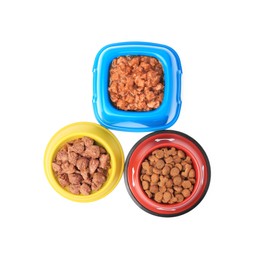 Dry and wet pet food in feeding bowls isolated on white, top view