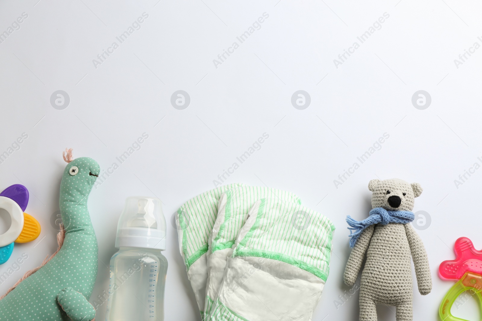 Photo of Flat lay composition with baby accessories and space for text on white background