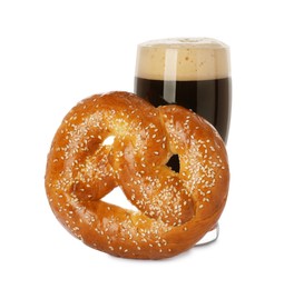 Photo of Tasty freshly baked pretzel and glass of dark beer on white background