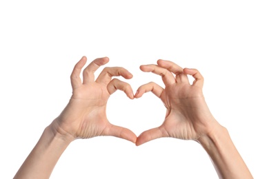 Photo of Woman making heart with her hands on white background, closeup
