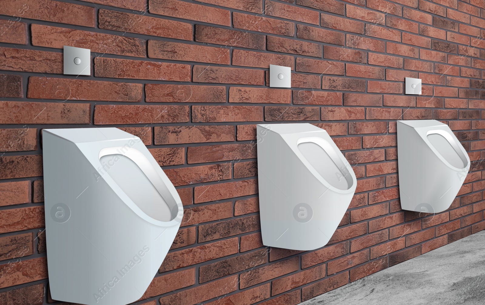 Image of Clean ceramic urinals in men's public bathroom