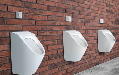 Image of Clean ceramic urinals in men's public bathroom