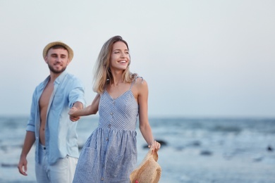 Young couple spending time together on beach