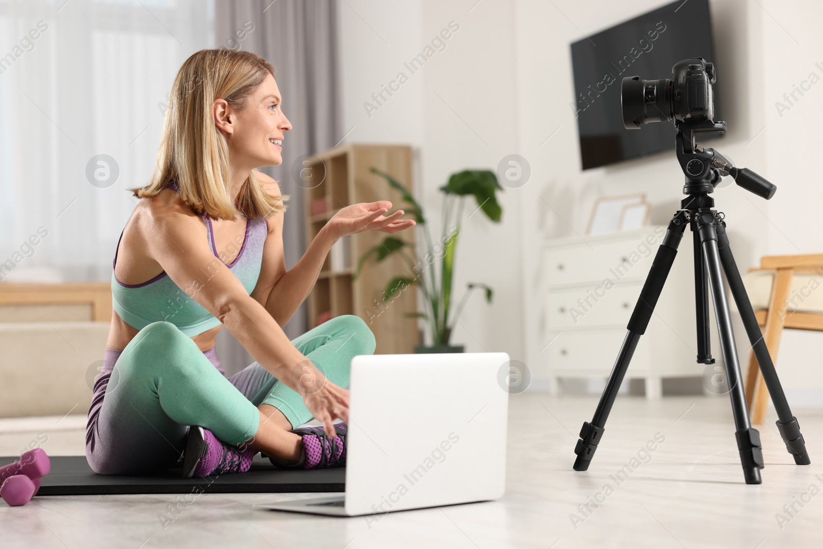 Photo of Fitness trainer recording online classes at home