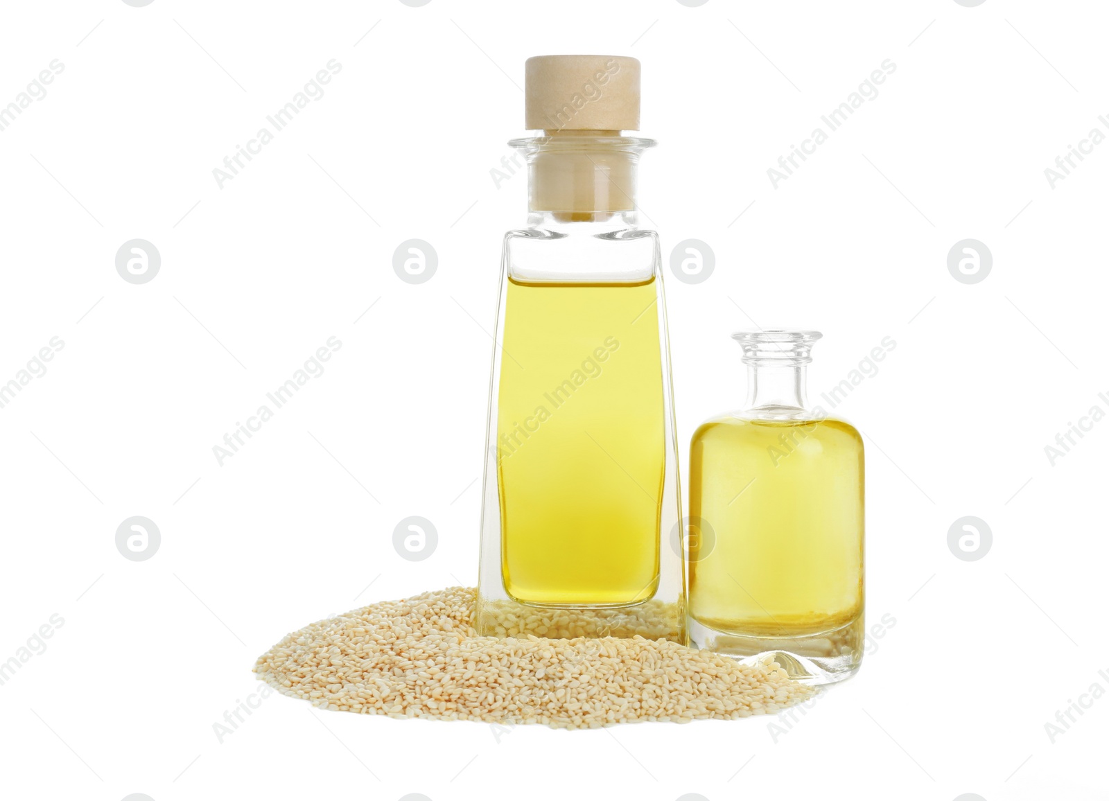 Photo of Fresh sesame oil in bottles and seeds isolated on white