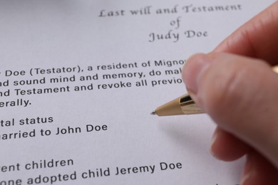 Woman signing Last Will and Testament, closeup
