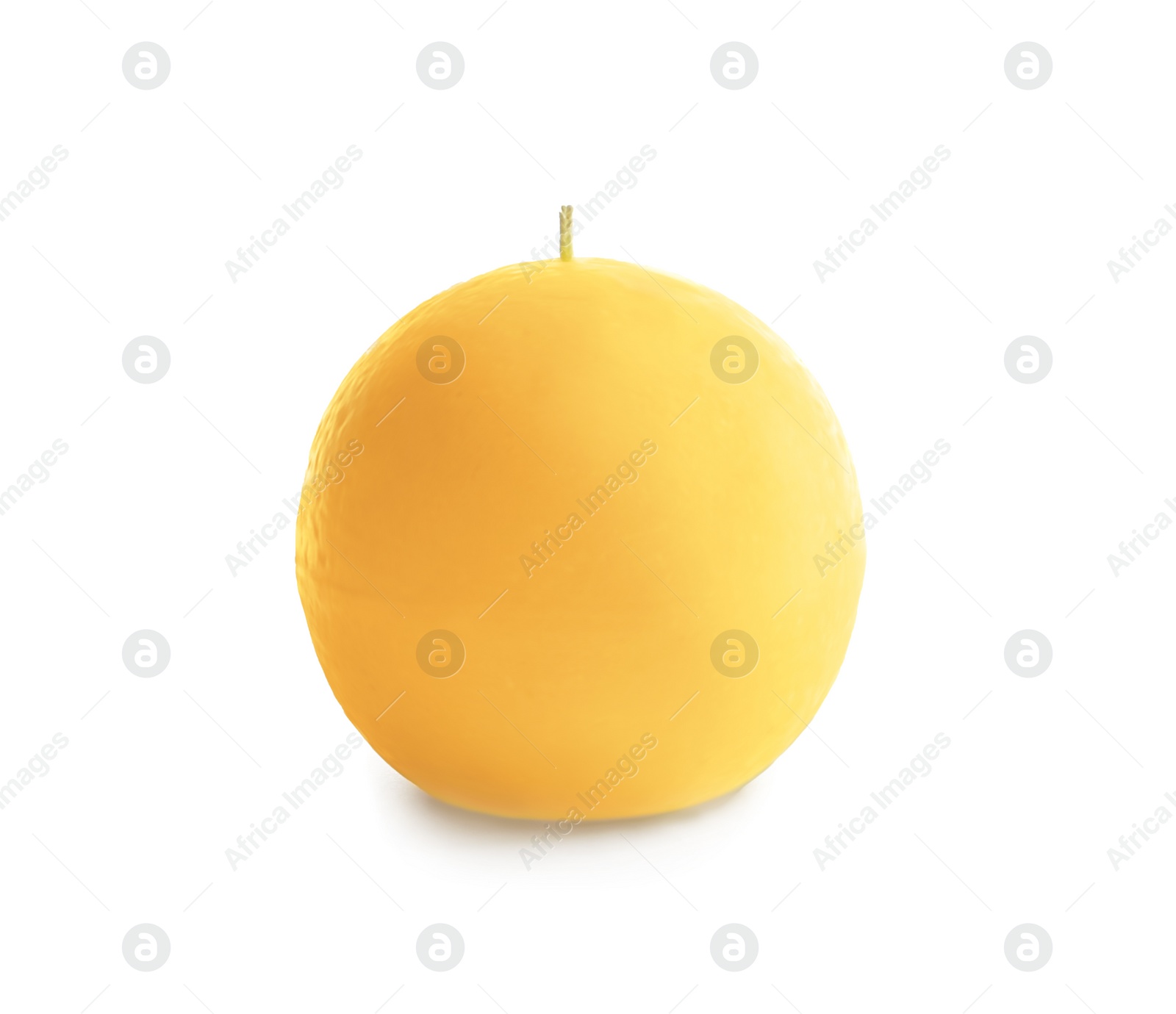 Photo of Yellow round wax candle on white background