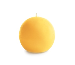 Photo of Yellow round wax candle on white background