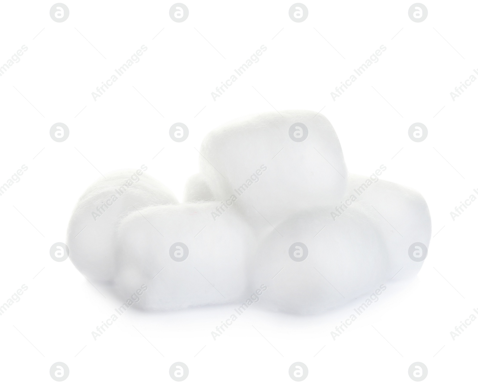 Photo of Balls of fluffy cotton on white background