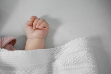 Photo of Cute little Baby in bed, closeup view
