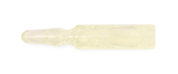 Photo of One glass ampoule with liquid isolated on white, top view